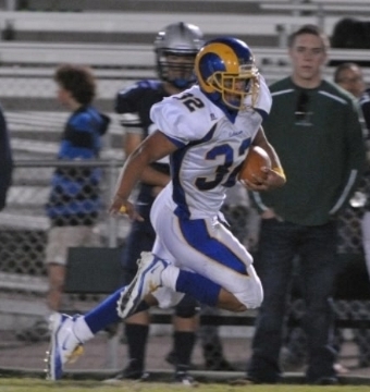 Joe Wilson heads for the endzone in a 2011 football game Robinson vs. South County